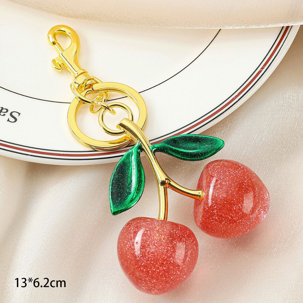 Gentle Pink Cherry Keyring paired with dual green leaves view 2