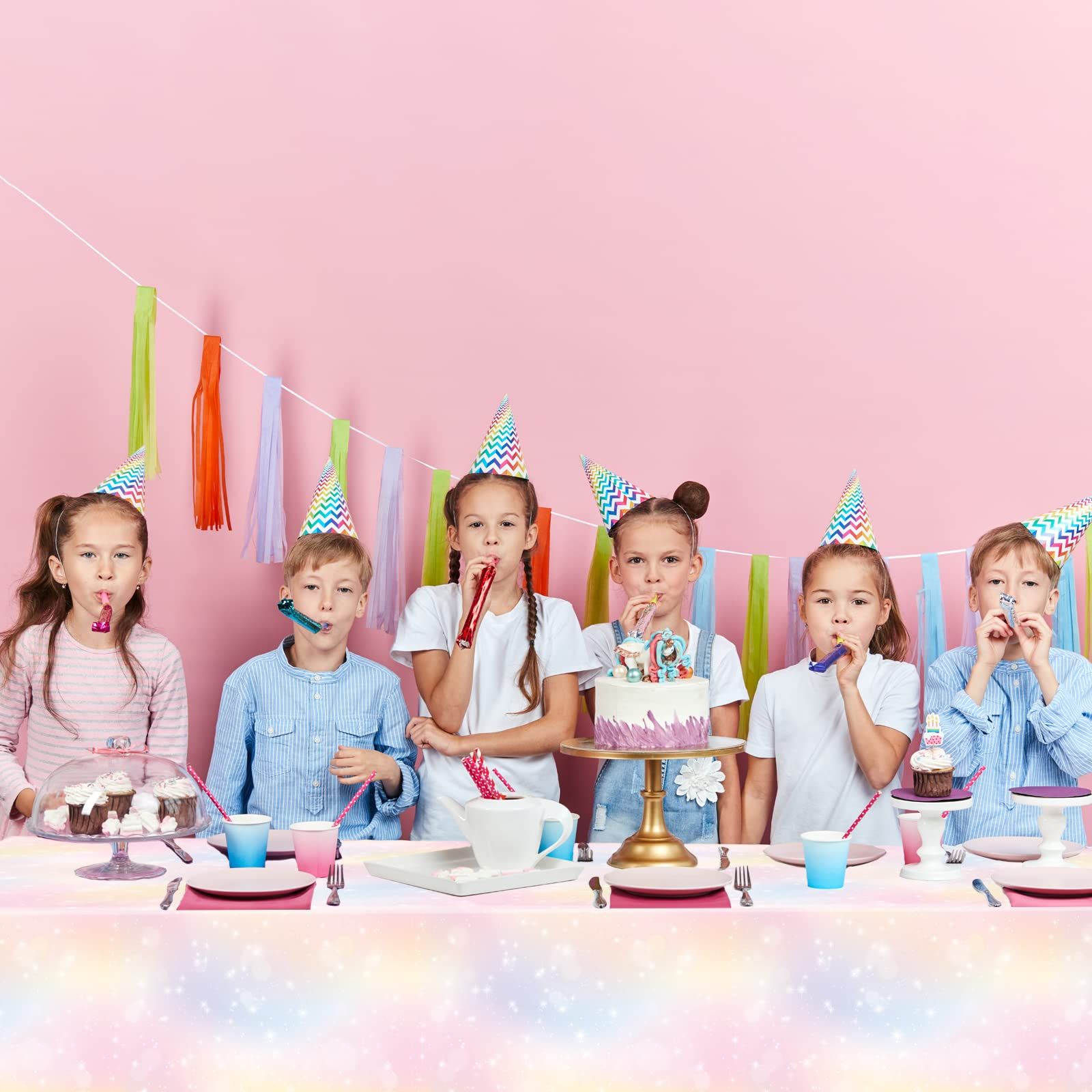 Rainbow birthday party decoration with colorful rainbow tablecloth view 3