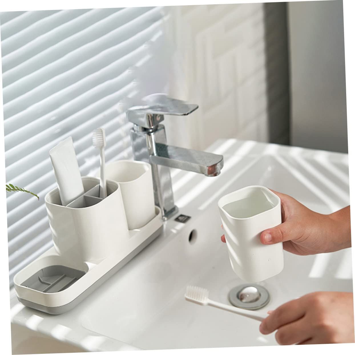 1 toothbrush holder, toothbrush holder, hanger, toothpaste dispenser, bathroom view 2