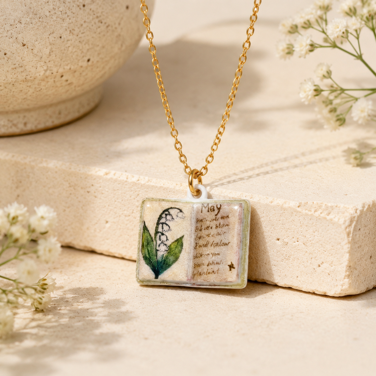 Vintage-style book necklace with May birthday flowers