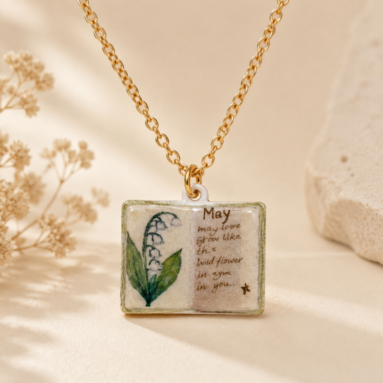 Vintage-style book necklace with May birthday flowers view 2