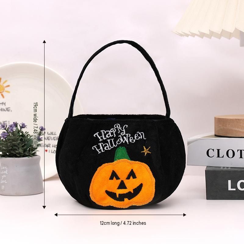 Black bag with a pumpkin pattern - Plush Halloween Trick or Treat Candy Bag view 6